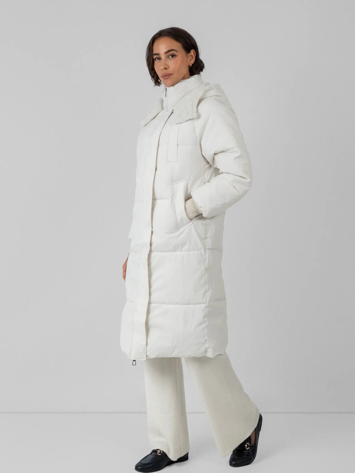 Women's Long Faux Fur Lined Hooded Puffer Coat in black – view 24