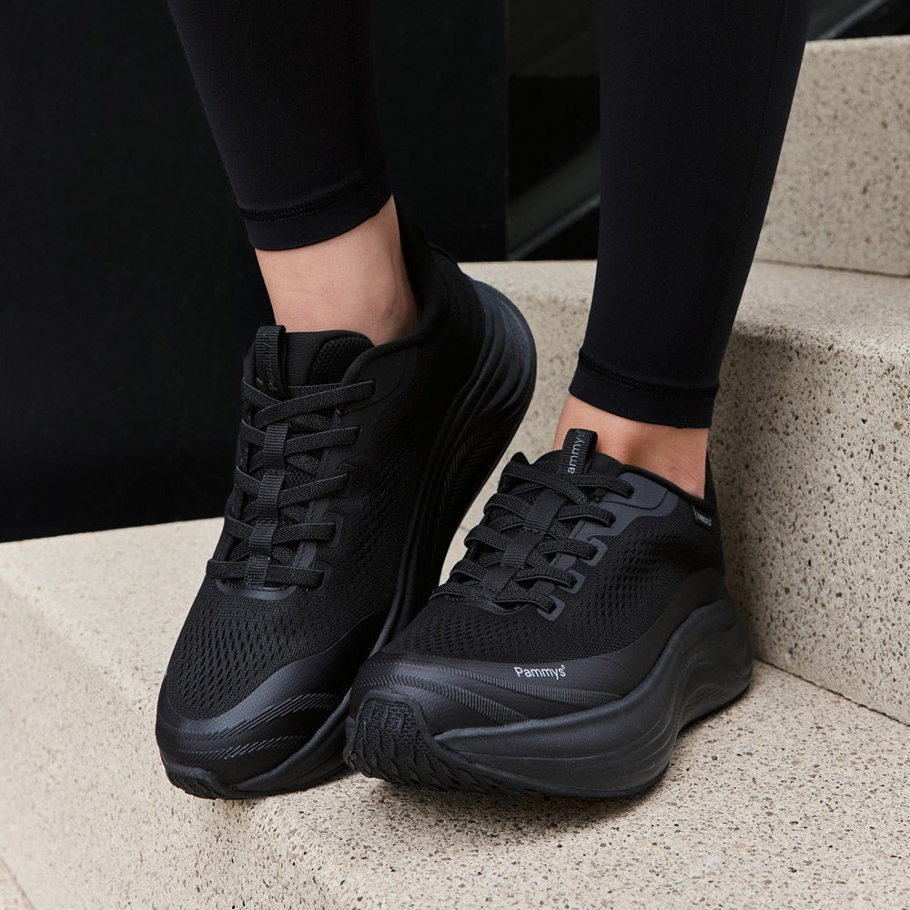 Women's Waterproof Hands-Free Trainers in black – on foot, close-up