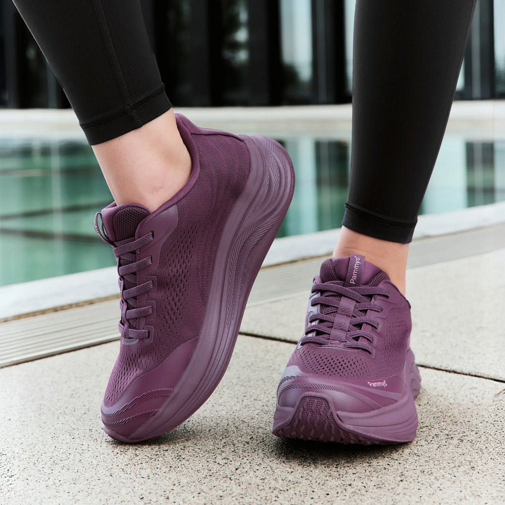 Women's Waterproof Hands-Free Trainers in burgundy – on foot, close-up