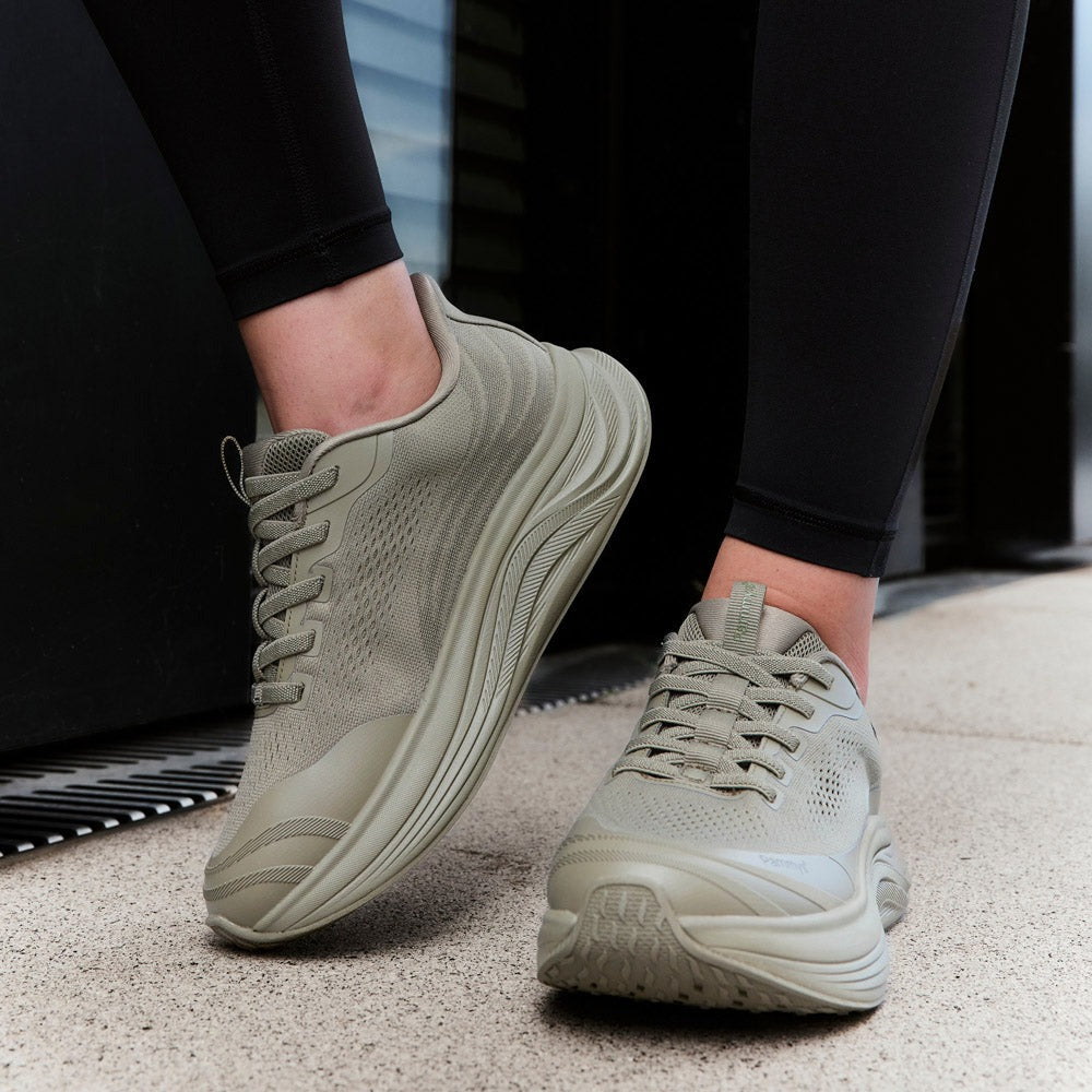 Women's Waterproof Hands-Free Trainers in khaki green – on foot outdoors
