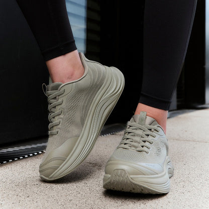 Women's Waterproof Hands-Free Trainers in khaki green – on foot outdoors
