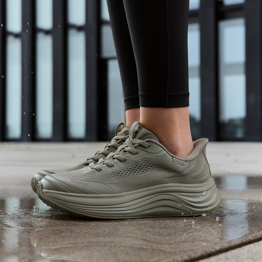 Women's Waterproof Hands-Free Trainers in khaki green – on foot, close-up